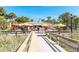 Inviting boardwalk leading to Paradise Grille, a beachfront eatery with outdoor seating and vibrant umbrellas at 505 67Th Ave # 5, St Pete Beach, FL 33706