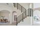 Modern staircase with metal railing, bright and airy at 5226 Golf Links Blvd, Zephyrhills, FL 33541