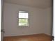 Well-lit bedroom featuring a window and wood flooring at 5265 E Bay Dr # 323, Clearwater, FL 33764