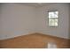 Bright bedroom with wood floors and large window at 5265 E Bay Dr # 323, Clearwater, FL 33764