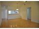 Dining room with wood floors and kitchen pass-through at 5265 E Bay Dr # 323, Clearwater, FL 33764