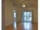 Living room with vaulted ceiling, wood floors, and sliding glass doors at 5265 E Bay Dr # 323, Clearwater, FL 33764