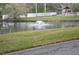 Serene pond with a fountain, surrounded by lush landscaping at 5265 E Bay Dr # 323, Clearwater, FL 33764