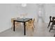 A modern dining room features a contemporary light fixture and wood accent chairs at 5331 71St N Way, St Petersburg, FL 33709