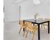 A well-lit dining room features an elegant modern chandelier and seating for six at 5331 71St N Way, St Petersburg, FL 33709