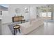 Modern living room with white decor, a zebra-print rug, and sliding glass doors to the patio at 5331 71St N Way, St Petersburg, FL 33709