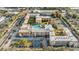 Panoramic aerial view showcases a large residential complex with a pool and tennis courts at 5820 N Church Ave # 247, Tampa, FL 33614