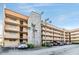 Exterior facade of a multi-story building highlighting stone accents and private balconies at 5820 N Church Ave # 247, Tampa, FL 33614