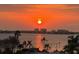 Stunning sunset over calm water with city skyline in the distance at 6025 Shore S Blvd # 504, Gulfport, FL 33707