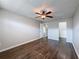 Spacious bedroom with laminate flooring and ceiling fan at 6025 Shore S Blvd # 504, Gulfport, FL 33707