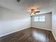 Bedroom with ceiling fan and dark wood-look flooring at 6025 Shore S Blvd # 504, Gulfport, FL 33707