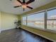 Bedroom with water views, ceiling fan, and dark hardwood floors at 6025 Shore S Blvd # 504, Gulfport, FL 33707