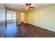 Spacious bedroom with wood-look floors, ceiling fan and walk-in closet at 6025 Shore S Blvd # 504, Gulfport, FL 33707