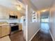 Modern kitchen features stainless steel appliances and light wood cabinets at 6025 Shore S Blvd # 504, Gulfport, FL 33707