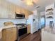 Bright condo kitchen with stainless steel appliances and light wood cabinets at 6025 Shore S Blvd # 504, Gulfport, FL 33707