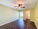 Open living room with dark wood-look floors and access to other rooms at 6025 Shore S Blvd # 504, Gulfport, FL 33707