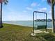 Serene waterfront view with a relaxing bench at 6025 Shore S Blvd # 504, Gulfport, FL 33707