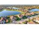 Beautiful aerial view of a community with serene lakes and tile-roofed homes at 6467 Willowshire Way, Bradenton, FL 34212