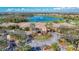 An aerial shot of the clubhouse entrance, highlighting the beautifully landscaped roundabout and manicured grounds at 6467 Willowshire Way, Bradenton, FL 34212