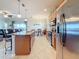 Kitchen island and dining area flow into the Gathering room, perfect for entertaining and Gathering living at 6467 Willowshire Way, Bradenton, FL 34212