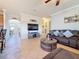 Comfortable living room featuring an open layout, neutral color palette, and a large window for natural light at 6467 Willowshire Way, Bradenton, FL 34212