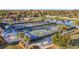 The community pickleball courts offer a fun and active lifestyle, surrounded by lush landscaping and a serene lake view at 6467 Willowshire Way, Bradenton, FL 34212