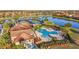 Aerial view of a refreshing community pool, clubhouse and pickleball, inviting residents to relax and enjoy the Florida lifestyle at 6467 Willowshire Way, Bradenton, FL 34212