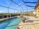 Private pool with a brick paver deck, and a screened-in enclosure at 6467 Willowshire Way, Bradenton, FL 34212