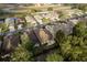 Aerial view of a neighborhood with houses, roads, and natural surroundings at 6538 Green Acres Blvd, New Port Richey, FL 34655