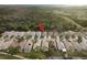 Aerial view of a residential neighborhood with houses and lush green spaces at 6538 Green Acres Blvd, New Port Richey, FL 34655