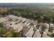 Aerial view of a community showing houses, roads, and natural surroundings at 6538 Green Acres Blvd, New Port Richey, FL 34655