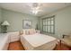 Light and airy bedroom with a comfortable bed and chair at 6538 Green Acres Blvd, New Port Richey, FL 34655