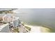 Serene aerial view of a coastal beach with a line of tall buildings and resorts at 684 Bayway Blvd, Clearwater, FL 33767