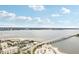 Scenic coastal view featuring a bridge, waterfront condos, and sandy beaches at 684 Bayway Blvd, Clearwater, FL 33767