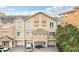 Charming multi-story townhouse featuring a well-maintained exterior, garages, and lush landscaping at 684 Bayway Blvd, Clearwater, FL 33767