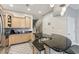 Well-lit kitchen with stone countertops, a stainless steel sink, and custom wood cabinets at 684 Bayway Blvd, Clearwater, FL 33767