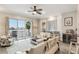 Stylish living room featuring a view of the lake, modern furniture, and lots of light at 684 Bayway Blvd, Clearwater, FL 33767