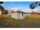 Private backyard with wooden fence and grassy area at 701 E Wood St, Tampa, FL 33604