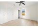 Bedroom with hardwood floors, a closet, and access to bathroom at 701 E Wood St, Tampa, FL 33604