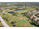 Wonderful aerial view of a beautiful community with pond, golf course and landscaping at 7161 Fairway Bend Cir, Sarasota, FL 34243