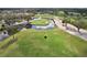 Beautiful green golf course with sand traps and a water hazard, with a view from above at 7161 Fairway Bend Cir, Sarasota, FL 34243