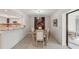 Dining area next to the kitchen boasting modern light fixture and open floor plan at 7161 Fairway Bend Cir, Sarasota, FL 34243