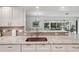 Stylish granite countertops and a stainless steel sink in this kitchen at 7161 Fairway Bend Cir, Sarasota, FL 34243