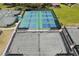 Aerial view of tennis and pickleball courts, perfect for recreational activities at 7161 Fairway Bend Cir, Sarasota, FL 34243