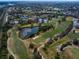 Expansive aerial view showcasing the community's golf course and surrounding neighborhoods at 7501 Cumberland Rd # 22, Seminole, FL 33777