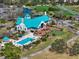 Aerial view of community clubhouse and pool adjacent to golf course at 7501 Cumberland Rd # 22, Seminole, FL 33777