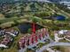 Aerial view of townhomes backing up to a golf course and pond at 7501 Cumberland Rd # 22, Seminole, FL 33777