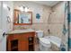 Bathroom featuring a vanity, tub, and shower combination, adorned with attractive tile accents at 7501 Cumberland Rd # 22, Seminole, FL 33777