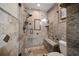 Elegant walk-in shower featuring stone-look tiles and a built-in bench for a spa-like experience at 7501 Cumberland Rd # 22, Seminole, FL 33777