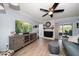 Spacious living room featuring a fireplace, modern decor, and a seamless connection to the outdoor patio at 7501 Cumberland Rd # 22, Seminole, FL 33777